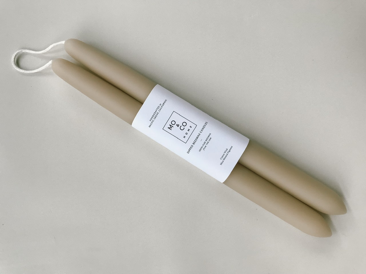 Neutral beige colored beeswax taper candles by Mo and Co Home